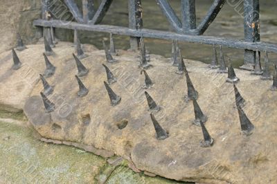 Spikes on Sandstone Wall