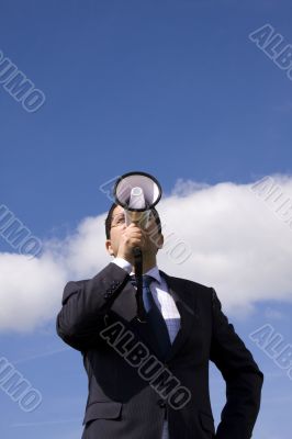 Businessman speaking with a megaphone