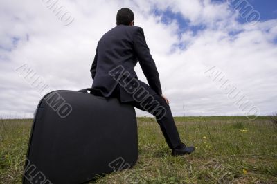 businessman sit in his baggage