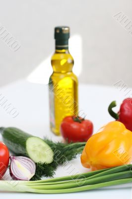 Multi-coloured vegetables for salad on a white background