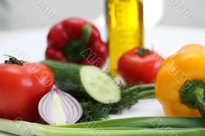 Multi-coloured vegetables for salad on a white background