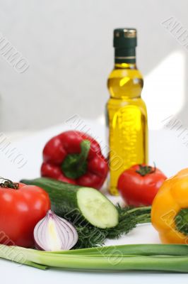 Multi-coloured vegetables for salad on a white background