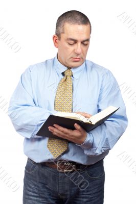 Business man reading a book