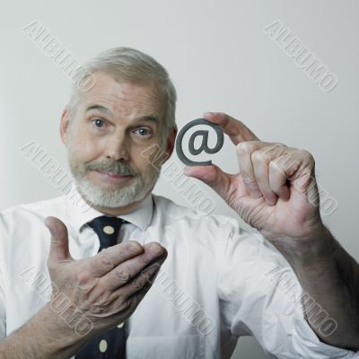Mature Man with internet symbol