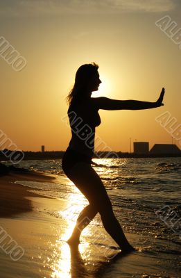 Sunset Tai Chi on a beach