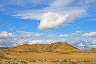 Hill under the cloudy sky