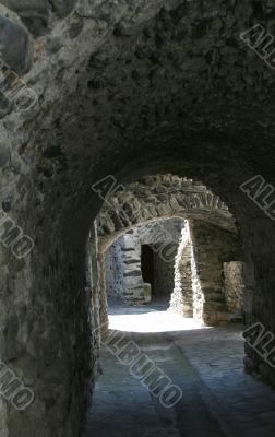 Passage of volcanic rocks in medieval village