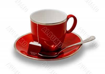 Isolated Empty Red Teacup and Saucer and Teabag