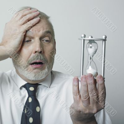 Desperated man with hourglass
