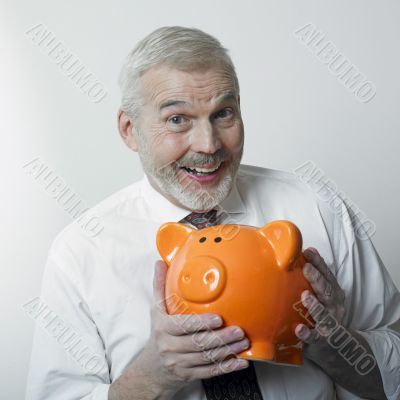 Happy man with piggy bank