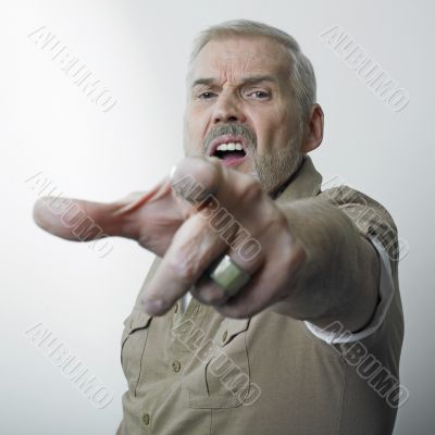 Matur man pointing finger