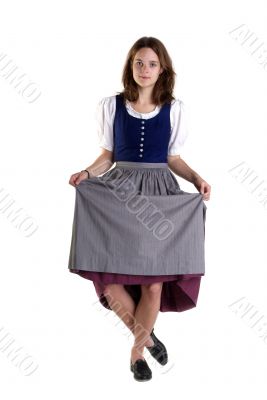 woman in Dirndl drops a curtsey