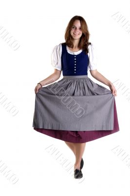 woman in Dirndl drops a curtsey