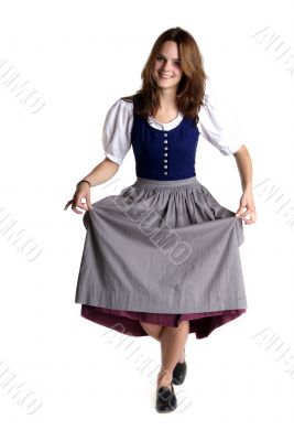 woman in Dirndl drops a curtsey