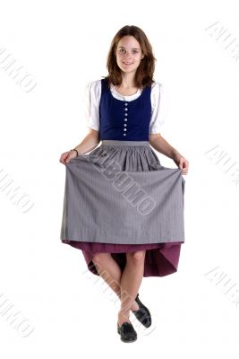 woman in Dirndl drops a curtsey