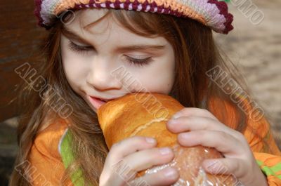 girl eating bread