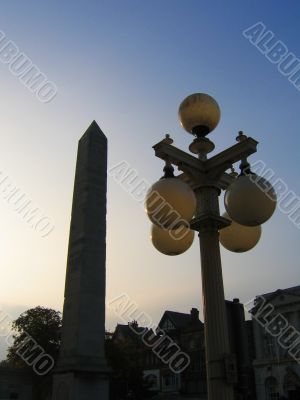 Cleopatra`s Needle and Old Streep Lamp Silhouette