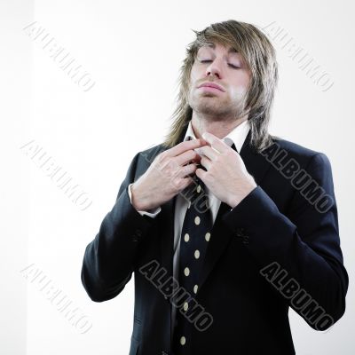 Man adjusting necktie