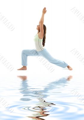 virabhadrasana warrior pose on white sand 2