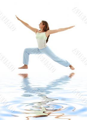 virabhadrasana warrior pose on white sand 3