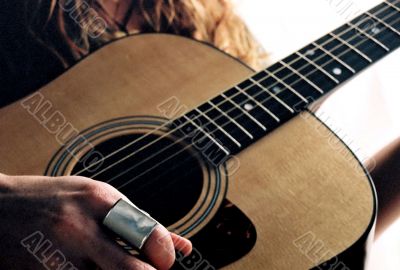 playing acoustic guitar