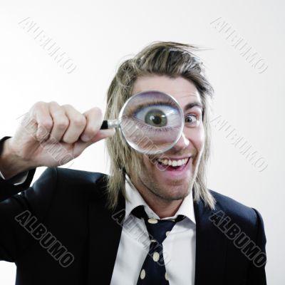 Happy man with magnifying lens