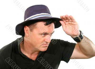 Man Looks Away In Hat