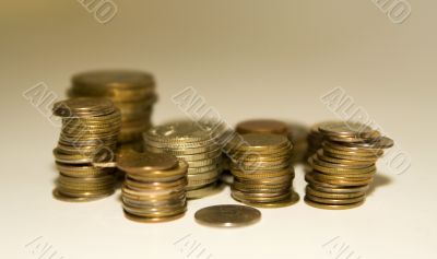 Coins on a white-gold background