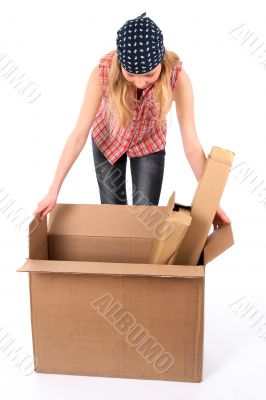 Young woman looking into an open box