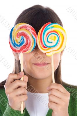 Girl eating two lollipops Girl eating two lollipops
