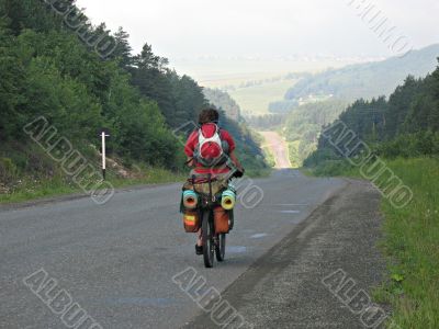 One cyclist go to road.