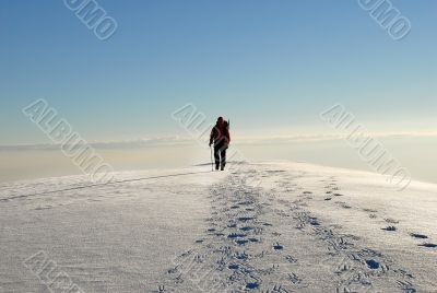 One man climber trekking  on a mountain