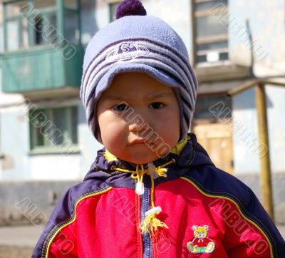 The Boy in hat with vizor.