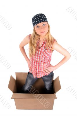 Girl in a cardboard box, looking up