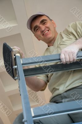 builder on a ladder