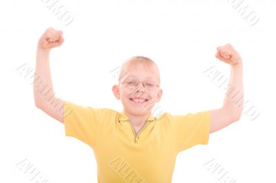 A young boy flexes his muscles