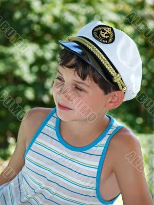 Boy in captain`s peak-cap