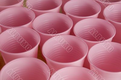a lot of pink plastic cups a lot of pink plastic cups