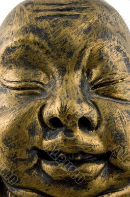 close up of golden buddha face close up of golden buddha face