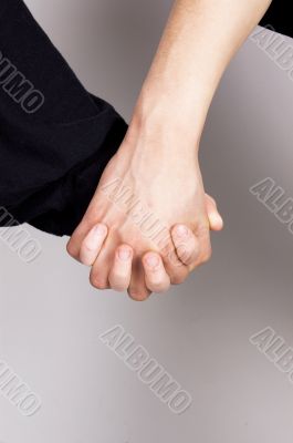 Children holding hands, symbolizing friendship
