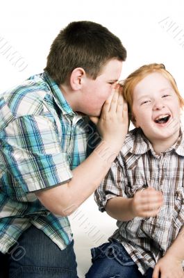 boy is whispering in girls ear boy is whispering in girls ear