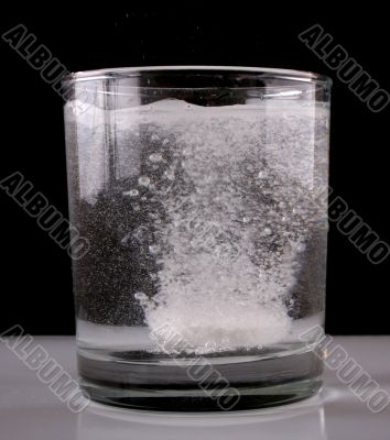 Glass of water with aspirin