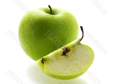 green fresh ripe apple with a slice