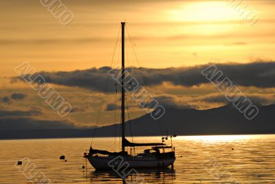 Yacht and sunrise in port of  Ushuaia,  Argentina.