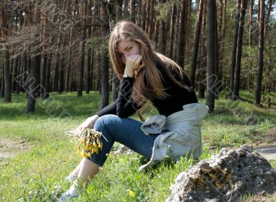 girl sitting on stone