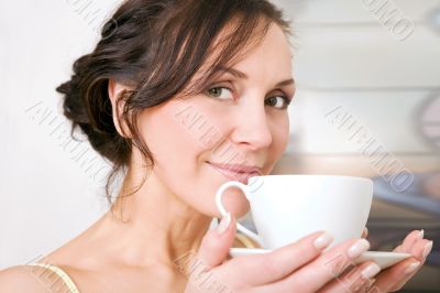 young woman enjoying a cup of tea