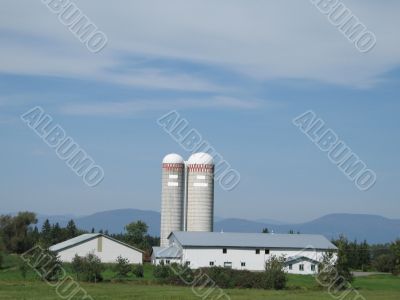a farm with two tall silos