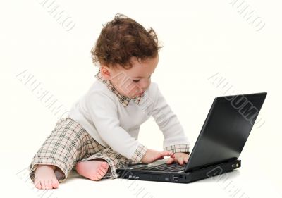 baby with black laptop