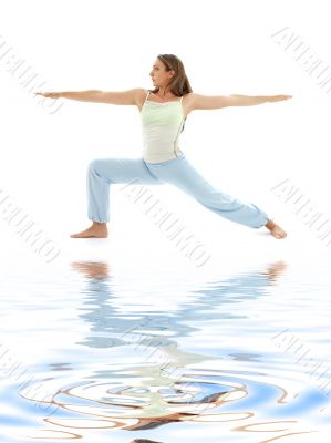 virabhadrasana warrior pose on white sand 4