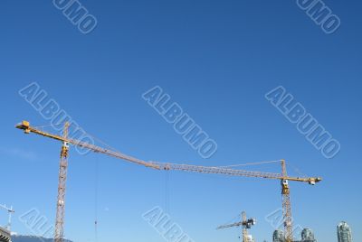 yellow construction cranes
